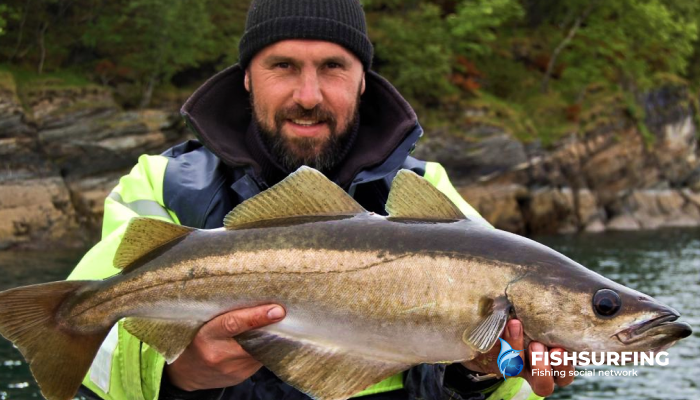 A fisherman in a quality sea fishing suit with reflective elements.